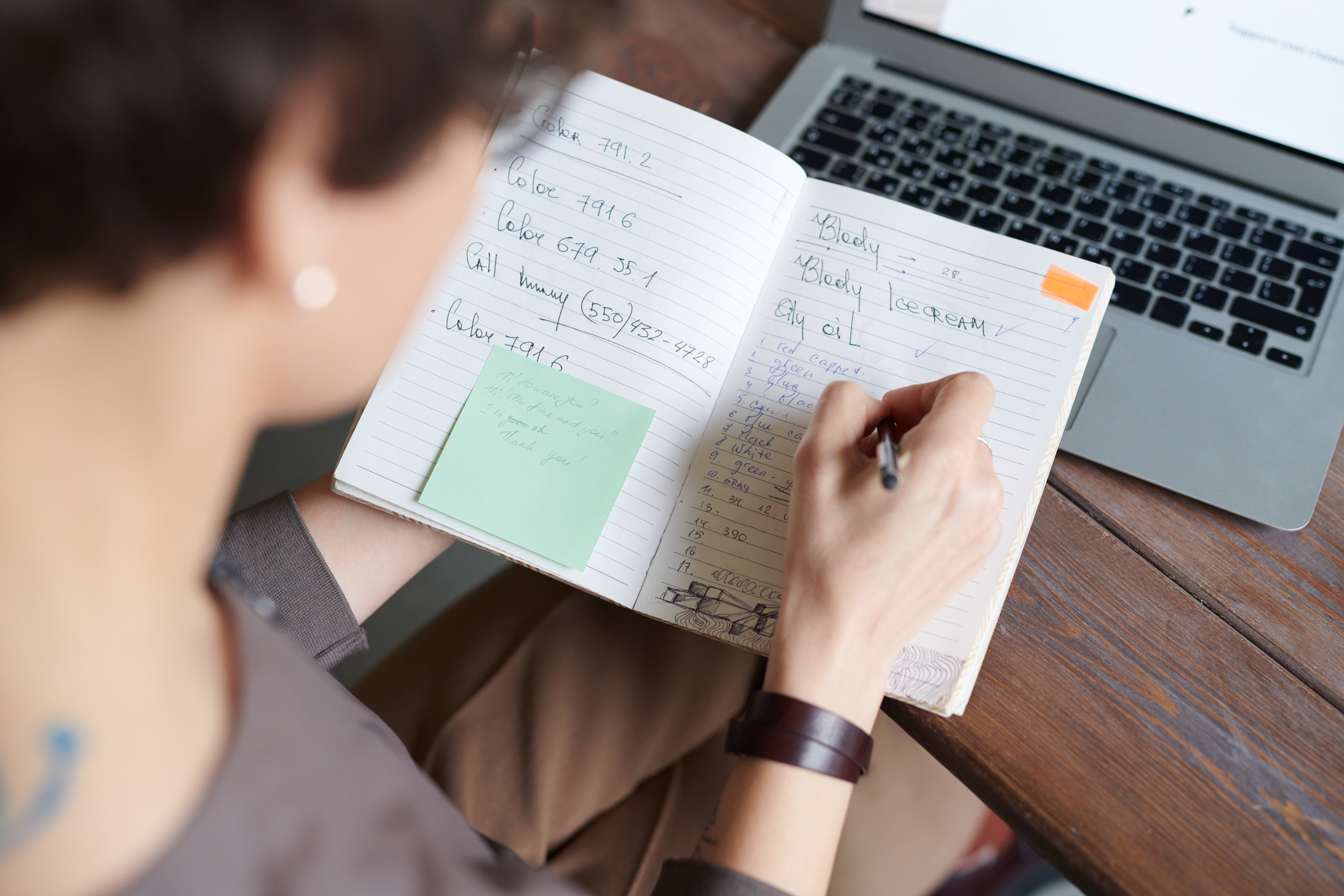 Take use of it. Person writing. Ideas for a writing in a Notebook. Writing on a Notebook. Write Notebook.